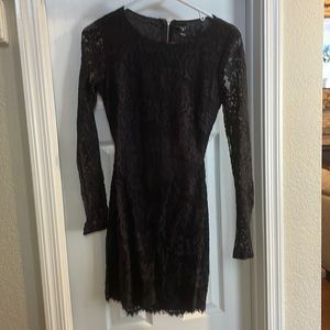 Black lace long sleeved semi formal dress. Short in length